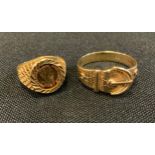 A 9ct gold buckle ring, size U, 4.4g; a 9ct gold Mexican coin signet ring, Maximiliano Emperadon,