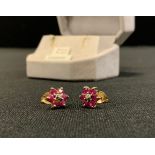 A pair of ruby and diamond floral cluster earrings, 9ct gold mount, 1.2g gross