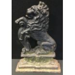 A cast iron door stop, as a lion rampant, 35cm high