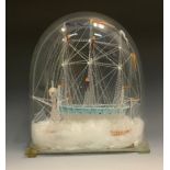 A 19th century Lampwork Glass Maritime model of a ship, with three masts, under a dome, 34cm high,