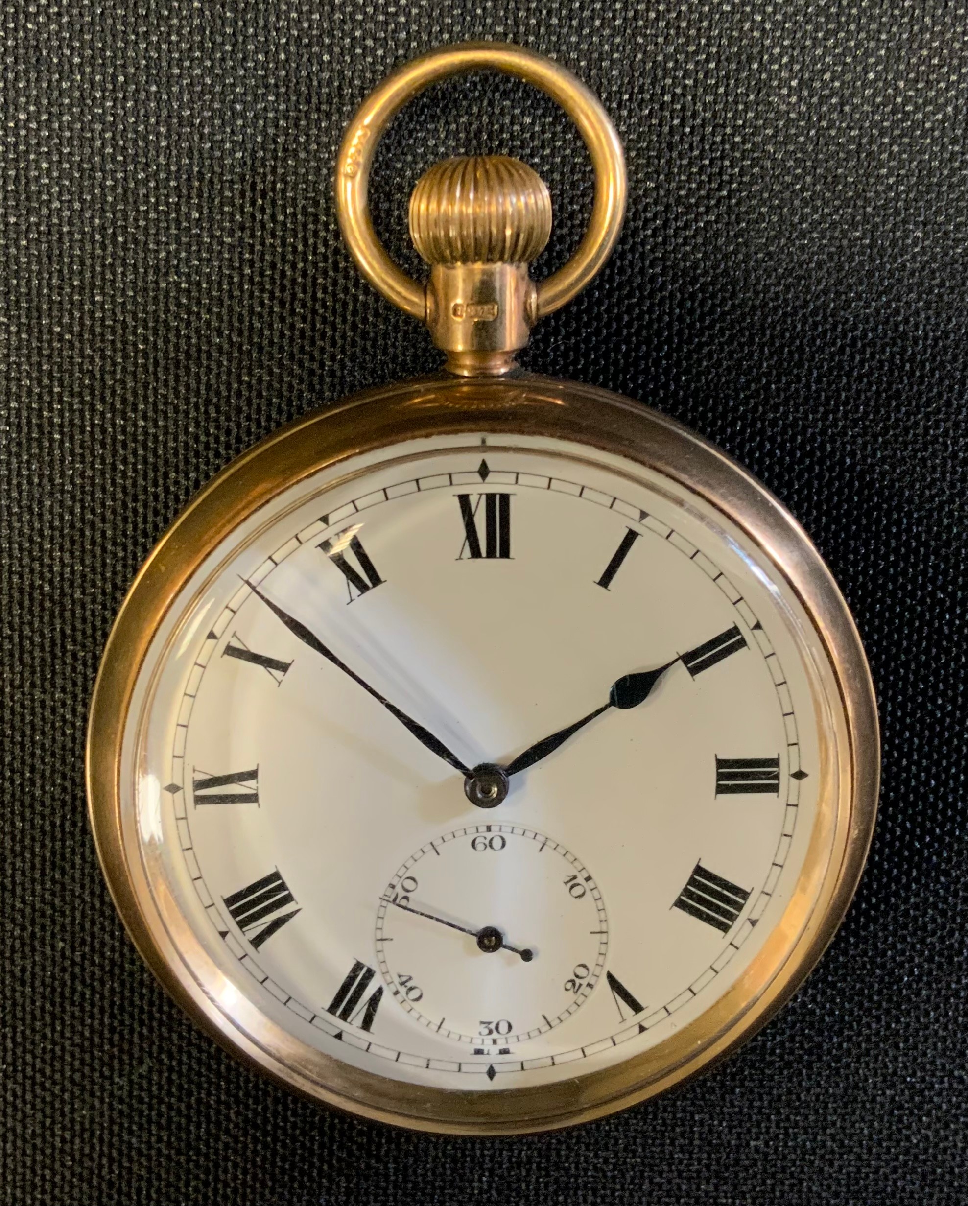 A 9ct gold cased open face pocket watch, cream dial, Roman Numerals, Swiss button wind movement,