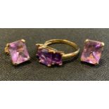 A vibrant purple amethyst platform ring, 9ct gold shank, size N/O, 2.7g gross; pair of similar