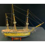 A large wooden model of HMS Victory, 76cm high, 92cm long