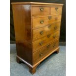 A 19th century mahogany chest, c.1800 of two short and four long cockbeaded drawers, bracket feet