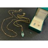 A 9ct gold ball and box link necklace, 3.4g; pale blue topaz pendant, stamped 9ct, gold plated