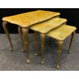 A set three onyx and gilt metal nest of tables, the largest 60cm wide, 37cm deep