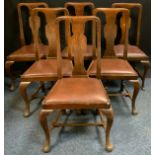 A set of six Queen Anne-style oak dining chairs, vasular splats, cabriole legs, leather seats, (6).