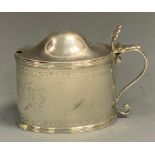 A George III silver tankard mustard, chased with bands, domed covers,pierced thumb piece, blue glass