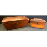 A large Victorian mahogany sarcophagus tea caddy, three lidded compartments; another smaller (2)