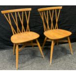 A pair of Ercol stick back Shalstone dining chairs