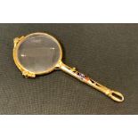 A rolled gold enamel lorgnette, the handle in tones of red, green and blue within a black ground,