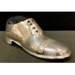 A silver pin cushion, as a shoe, Birmingham 1900, oak sole, 12.5cm long