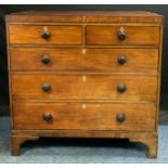 A 19th century mahogany chest, c.1820 outlined with ebony barber pole stringing, two short and three