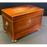 A 19th century mahogany rectangular tea caddy, two lidded compartments, 19cm wide, c.1800