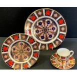 A Royal Crown Derby 1128 Imari plate, 21.5cm diameter, coffee can saucer and side plate, all first