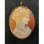 A shell cameo brooch, maiden, 9ct gold frame, stamped 9ct, 10.9g gross