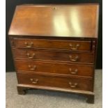 A George III mahogany bureau, c.1780 the fall front with fitted interior, above four long cockbeaded