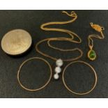 A yellow metal pendant necklace and chain, stamped 14K; a pair of 9ct gold hoop earrings; a pill