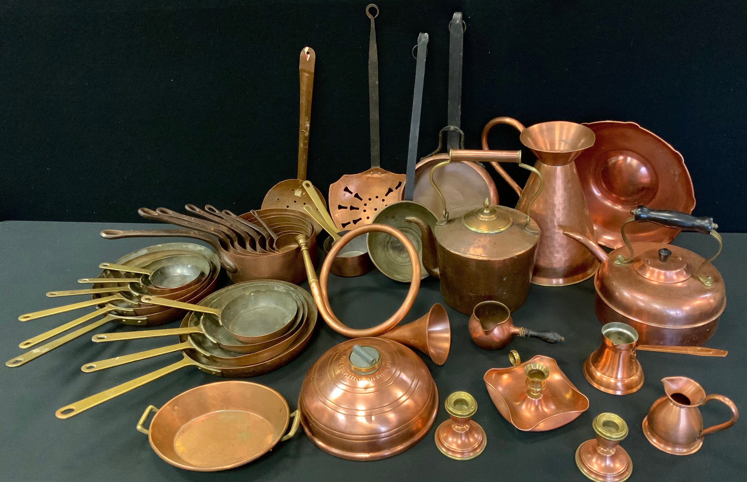 Brass & Copper - a set of five graduated copper bowl saucepans; other sets four; kettle, jug; etc