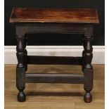 A 19th century oak joint stool, oversailing rectangular top with notched ends, turned legs,