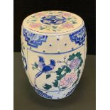 A Chinese barrel seat, decorated with flowers, 27cm high, 22cm diameter