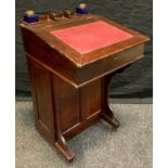 An early 20th century child's stained mahogany davenport, 66cm high