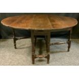 An early 18th century oval oak drop leaf table, turned stretchers, 136cm wide, 144cm wide, c.1720