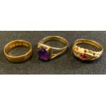 Rings - a 22ct gold wedding band, 2.3g; 18ct gold diamond and ruby ring, 2.3g gross; 9ct amethyst