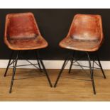 Modern Design - a pair of leather clad bucket chairs, in the manner of Charles Eames, tubular