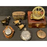 A reproduction brass sundial compass, brass bound box with hinged cover; a brass reproduction ship's