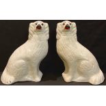 A pair of Victorian Staffordshire Spaniel mantel dogs, glass eyes, 33cm high