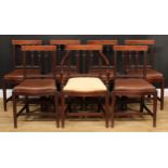 A set of seven Sheraton period mahogany dining chairs, comprising six side chairs and a carver,