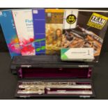 Musical Instruments - a Trevor James flute, cased; flute stand, boxed; flute music books