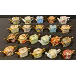 A collection of Ayshford China miniature teapots, various patterns including garden flowers, William