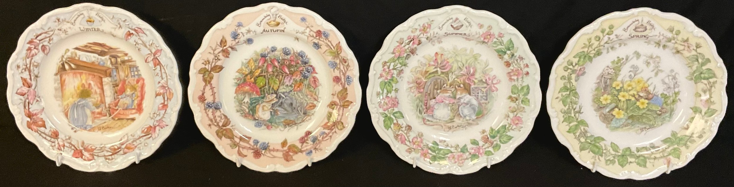 A set of four Royal Doulton Brambly Hedge shaped circular plates, the Four Seasons, 21cm diameter