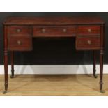 A George III mahogany kneehole writing table, turned legs, brass casters, 78cm high, 108cm wide,