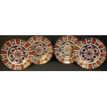 A set of four Royal Crown Derby Imari palette 1128 pattern dinner plates, 27cm diameter, printed