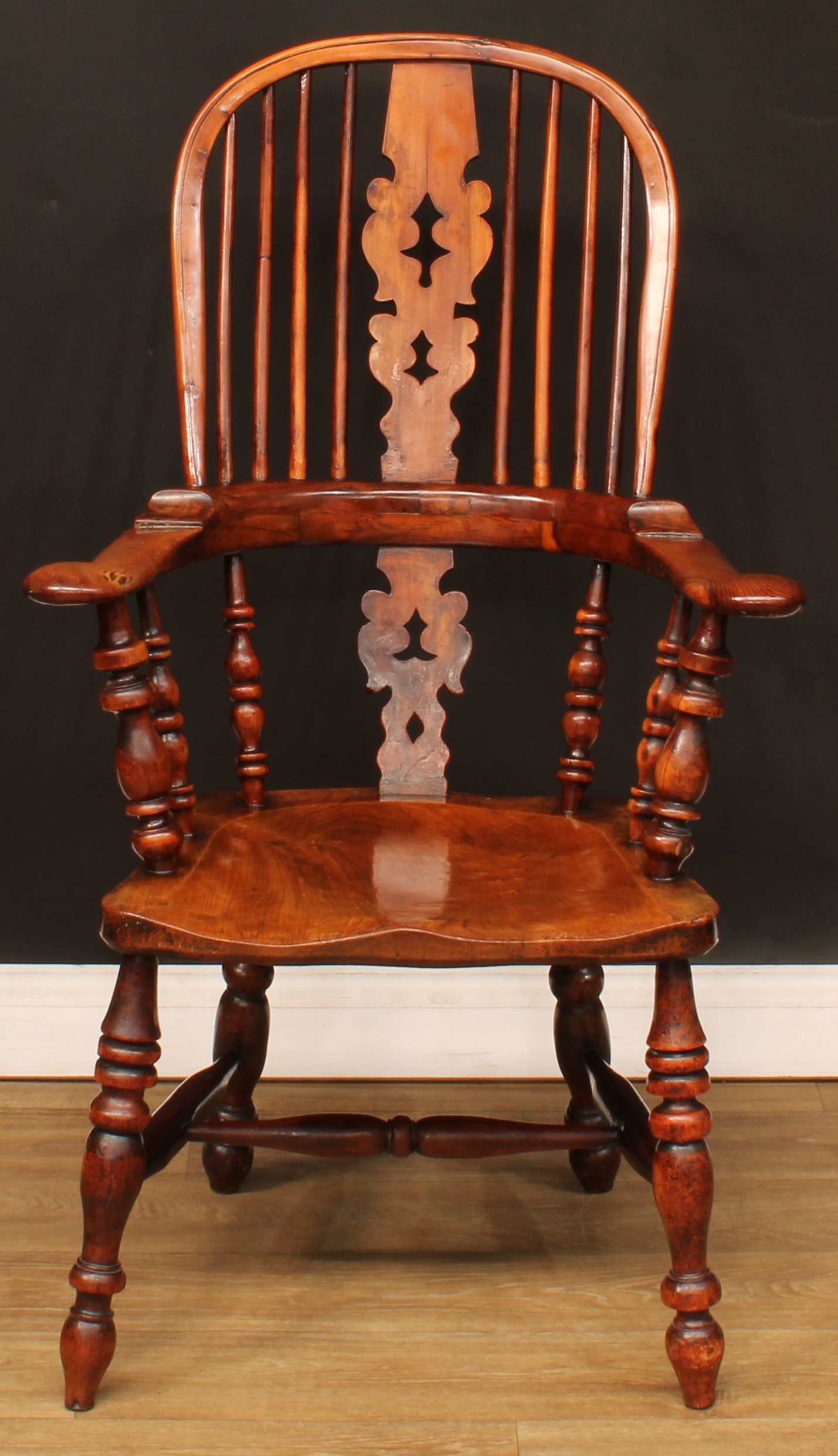 A 19th century North Yorkshire yew and elm Windsor elbow chair, by J. Watson, Skipton, hoop back,