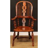 A 19th century North Yorkshire yew and elm Windsor elbow chair, by J. Watson, Skipton, hoop back,