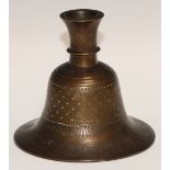 A Middle Eastern bronze bell shaped hookah base, chased in the Islamic taste with intersecting