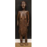 Tribal Art - a tall African figure, hollow to verso as a food bowl or reliquary, 131cm high, 35cm