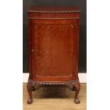 A George II Revival mahogany bowfront music cabinet, slightly oversailing top above a blind fretwork
