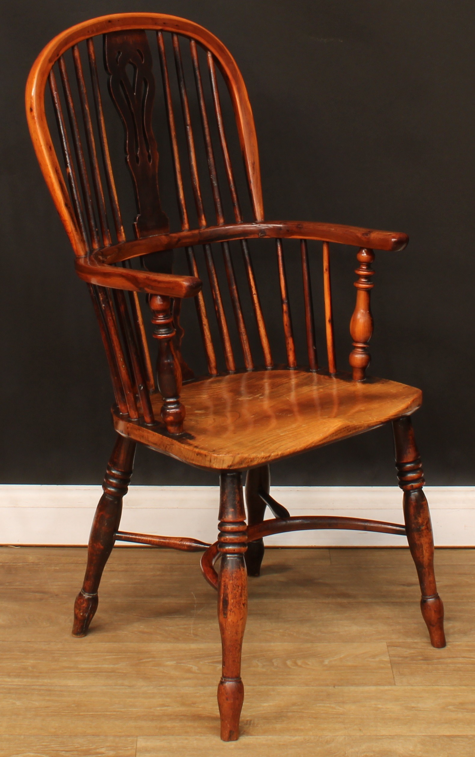 A 19th century yew and elm Windsor elbow chair, hoop back, shaped and pierced splat, one-piece mid- - Image 2 of 4