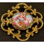 A Georgian gilt brooch, set with oval Bilston type enamel, lady holding flowers