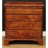 A George III mahogany bachelor’s chest, rectangular top above a slide and four long graduated
