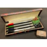 A set of four sterling silver bridge retractable pencils, boxed; a small silver snuff box, hinged