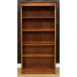 A tall oak open bookcase, carved frieze, 185cm high, 93.5cm wide, 35cm deep, the book depth 29cm