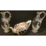 A pair of 19th century Mary Gregory style enamelled clear glass jugs, hand painted; a