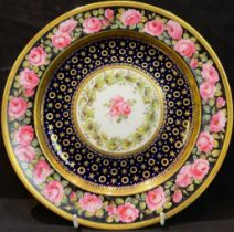 A Royal Crown Derby cabinet plate, painted with roses, gilded blue band, late 19th/early 20th