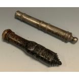 A soapstone cannon, engraved with stylised flowers and scrolls, 14cm long; another, iron, 16cm